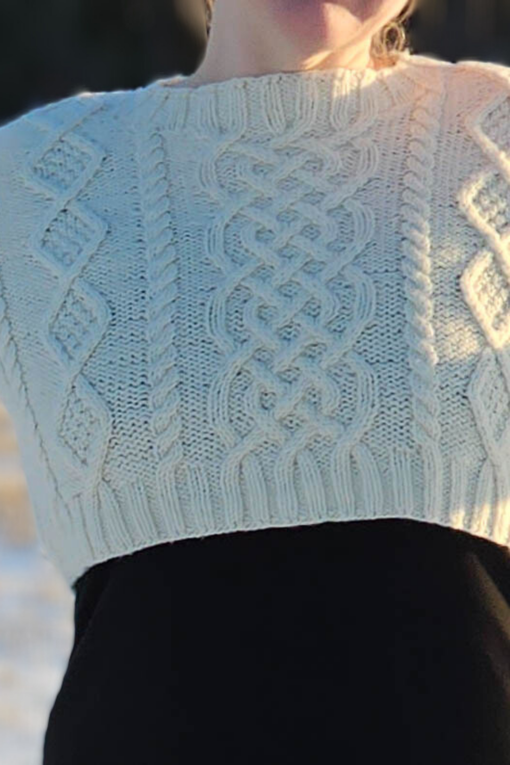 close up of hand knit aran cable knit sweater cropped y2k style 